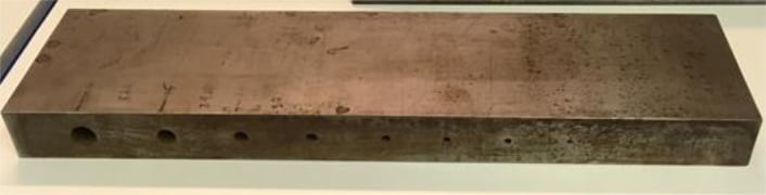 Fig. 1 - Test block and side drilled holes used in the study, the holes can be seen to decrease in size from left to right